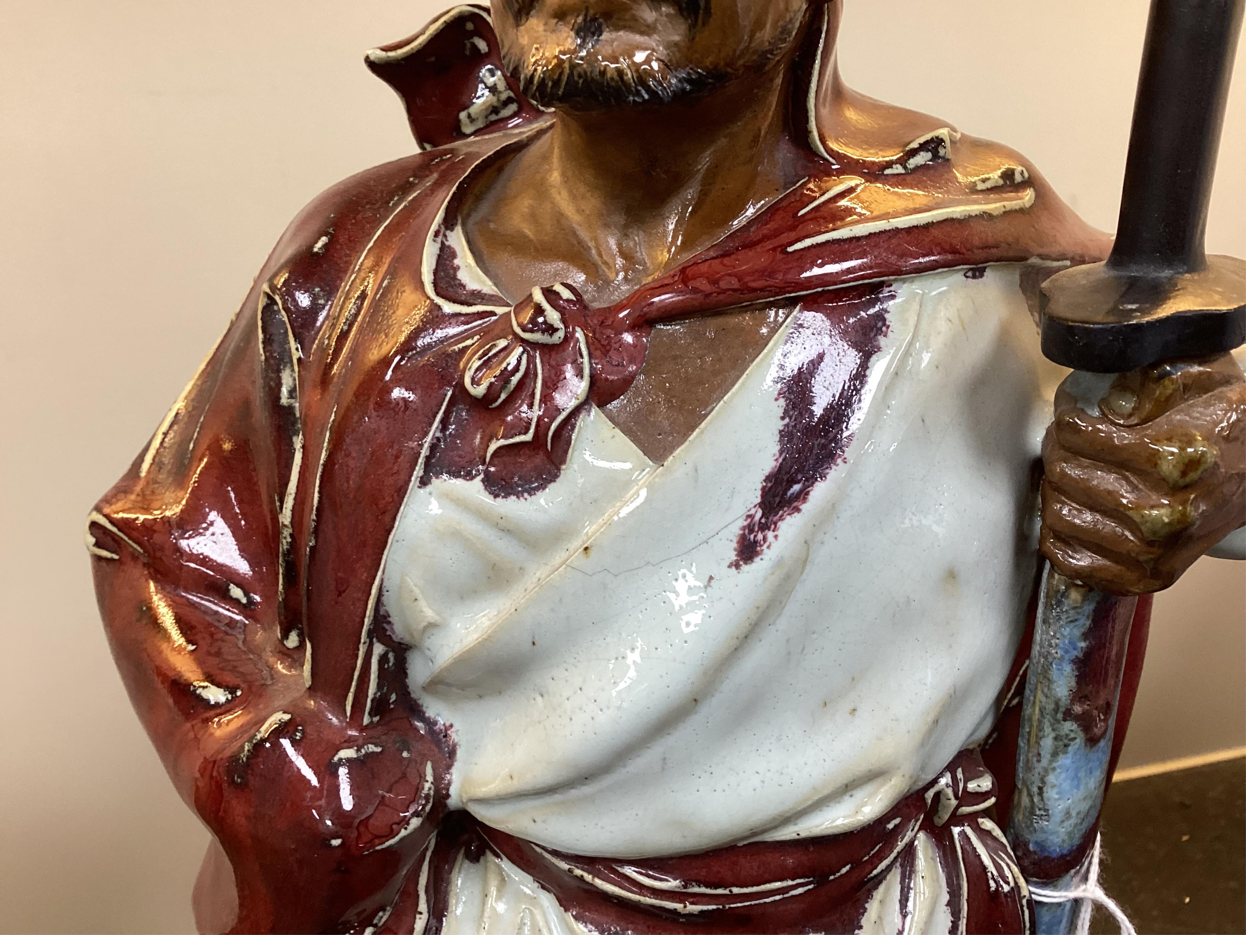 A large Chinese Shiwan stoneware figure of a warrior, 20th century